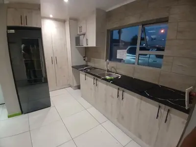 a kitchen with a sink and a counter top at Neo & Ruks Guest House goodwood 4 in Goodwood