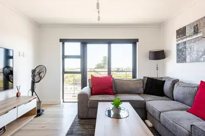 a living room with a couch and a table at Lifestyle Accommodation in Cape Town