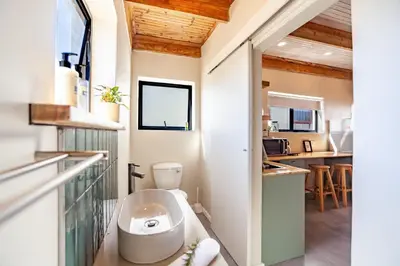 a bathroom with a toilet in the middle of a room at Lily's Pad in Oakdale