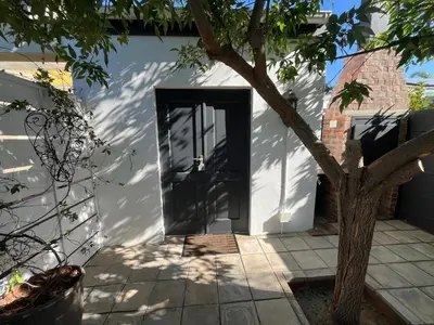 a door to a house with a tree at Te Môi in Paarl