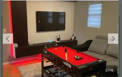 a living room with a red pool table in it at YA Eagle Wings Self Catering Shared Single room Apt B in Cape Town