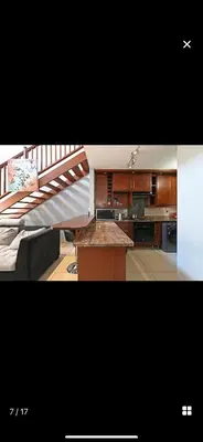 a kitchen with a staircase leading to a living room at YA Eagle Wings Self Catering Shared Single room Apt B in Cape Town