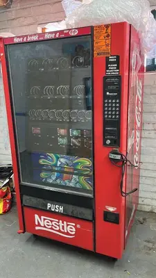 a cocacola microwave oven is sitting on the street at The Cola Cabana in Cape Town