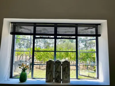 a window with two books on a window sill at Hephzibah Inn Signature Farm Cottage in Hermon