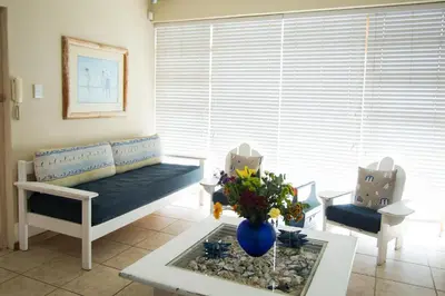 a living room with a couch and a table at 9 Lantra in Strand
