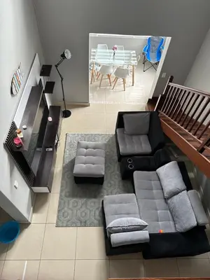a living room with a couch and a table at YA Eagle Wings Self Catering Shared Single room Lodge B in Cape Town