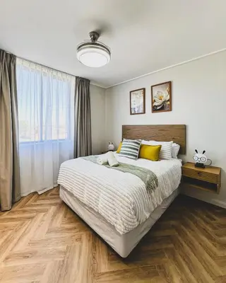 a bedroom with a large bed and a large window at Peace On Park by Dajosha booking in Cape Town