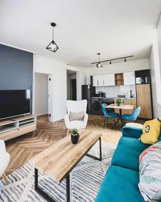 a living room with a couch and a table at Peace On Park by Dajosha booking in Cape Town
