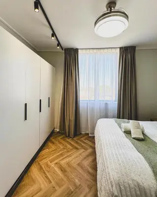 a bedroom with a bed and a large window at Peace On Park by Dajosha booking in Cape Town