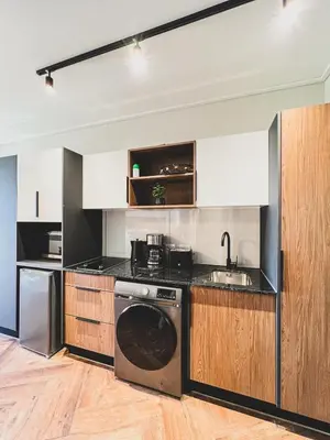 a kitchen with a washer and a dishwasher at Love on Park by Dajosha bookings in Cape Town