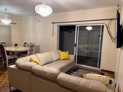 a living room with a couch and a table at Miches House in Cape Town