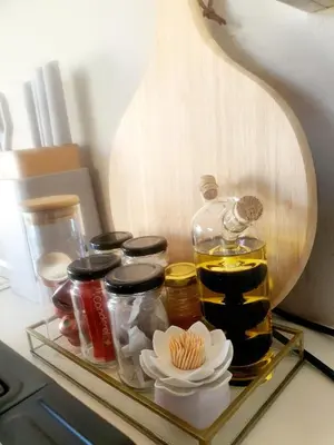 a tray with jars and other items on a counter at Casa La Mer Guesthouse in Strand