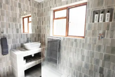 a bathroom with a sink and a mirror at Mystical Serenity in Durbanville