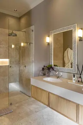 a bathroom with a shower and a sink and a mirror at Pink Door Franschhoek by The Oyster Collection in Franschhoek