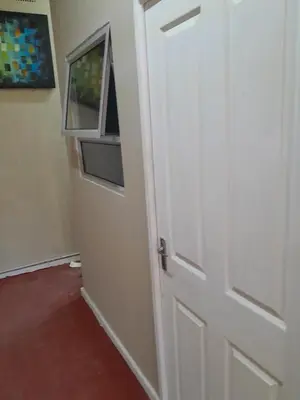 an open door with a window in a room at BDC Paarl Accommodation and Guest House in Paarl