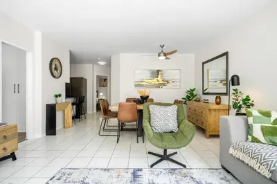 a living room and dining room with a table and chairs at 14 Cap dAzur by Host Agents in Cape Town