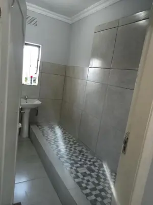 a bathroom with a shower and a sink at At-home Oakdale Bellville in Bellville