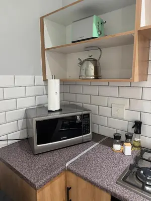a microwave sitting on a counter in a kitchen at The Protea & Vine - Paarl - Self Catering Apartment in Paarl