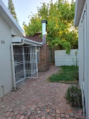 a driveway leading to a house with a gate at Chez Yves 2 in Hoheizen