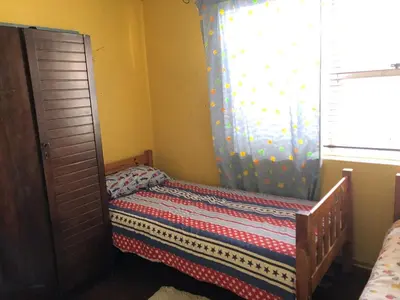 a small bedroom with a bed and a window at Home from Home in Welton
