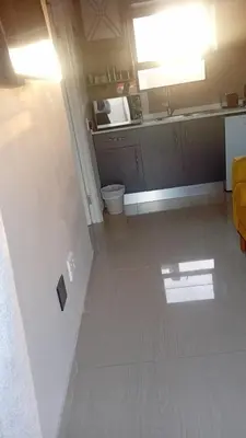 a bathroom with a sink and a toilet in a room at Bokwe's Guest House- Cape Town in Gordonʼs Bay