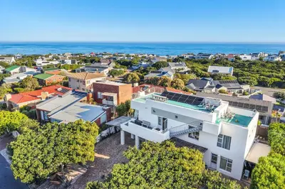 an aerial view of a neighborhood with a white house at Vermont Dreamcatcher in Hermanus