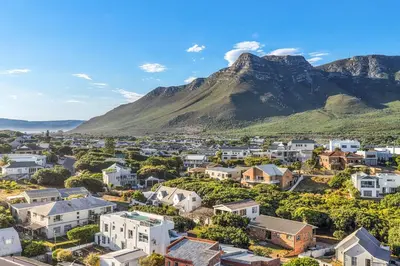 a city with a mountain in the background at Vermont Dreamcatcher in Hermanus