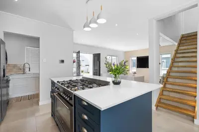 a kitchen with a stove and a white counter top at Metalasia Four in Bettyʼs Bay