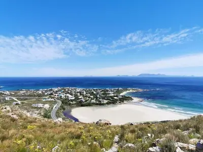 an aerial view of a beach and the ocean at Klein-Hangklip Remote Mountain Studio Cottage in Rooiels