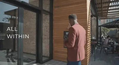 a man standing in front of a building at Luxe at Nine Palms Near Canal Walk in Cape Town