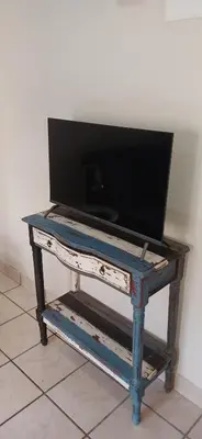 a tv sitting on top of a table at Salt & Cellar - Paarl - Self Catering Apartment in Paarl