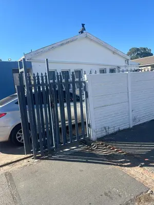a gate in front of a white fence at home away in Bellville South