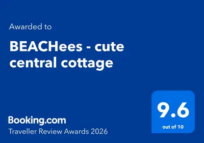 a screenshot of a cell phone with the words beaches cubic central cottage at BEACHees - cute central cottage in Kleinmond
