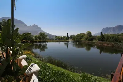 a view of a river with mountains in the background at Le Pommier Wine Estate in Stellenbosch