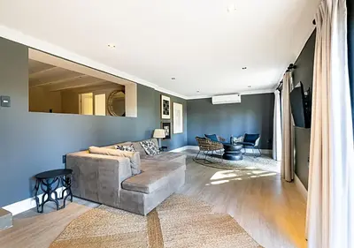 a living room with a couch and a table at Von Wyn Berg in Stellenbosch