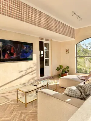 a living room with a couch and a table at Grande Casa - Central Stellenbosch in Stellenbosch
