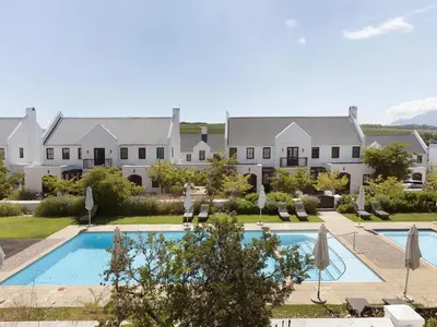 an image of a house with a swimming pool at Winelands Golf Lodges 1 in Onder-Papegaaiberg