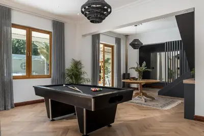 a billiard room with a pool table at Franschhoek Homestead Manor House in Franschhoek