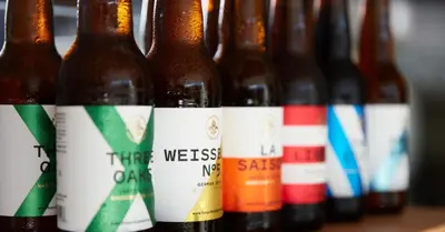 a row of different types of beer bottles at Franschhoek Homestead Manor House in Franschhoek