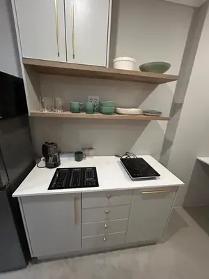 a kitchen with a stove and some green bowls at The Perfect Stay Somerset 1 in Somerset West