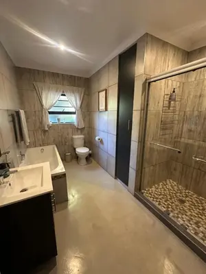 a bathroom with a shower and a sink and a toilet at The Peaceful Nook Somerset 2 in Somerset West
