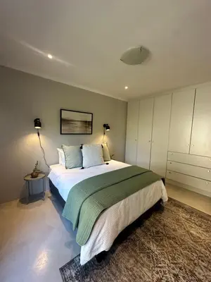 a bedroom with a large bed in a room at The Peaceful Nook Somerset 2 in Somerset West
