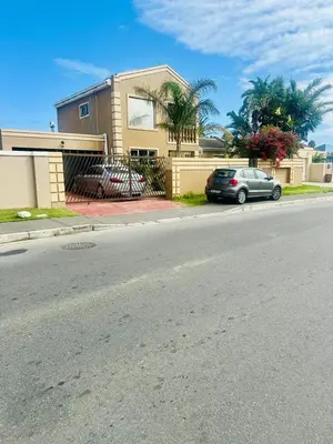 a house with a car parked on the side of a street at Hideaway Haven 2 in Cape Town