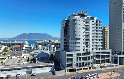 a view of a city with buildings and the ocean at Aquarius 2 Bedroom Luxury Apartment in Cape Town