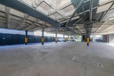 an empty parking lot in a parking garage at Cape on Porterfield in Cape Town