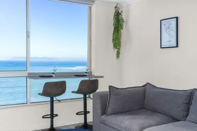 a living room with a couch and a table at Odeon Towers 808 by Host Agents in Cape Town