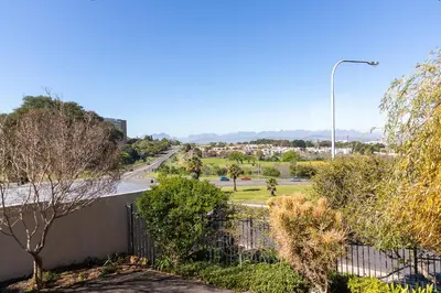 a view of a street with trees and a street light at Tyger Classique Self-Catering Cape Town, Tyger Valley in Bellville