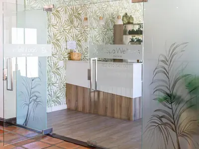 a display window of a store with plants on the wall at Winelands Golf Lodges 5 in Stellenbosch