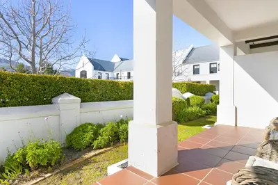 a view of a house from the porch of a home at Winelands Golf Lodges 33 in Stellenbosch
