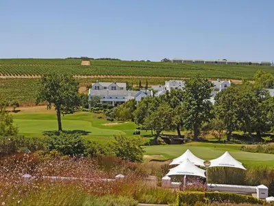 an aerial view of a golf course with a house at Winelands Golf Lodges 38 in Stellenbosch
